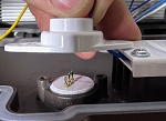 Receptacle Holder for models that did 1 - top-down view, white, plastic led module or component being tested in laboratory