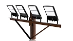 300W LED Parking Lot Lighting Package 1 - 3/4 view, four black led stadium lights mounted on brown steel support structure